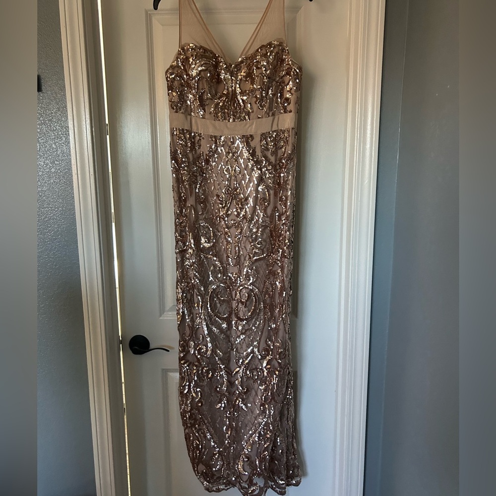 Rose gold sequin maxi dress with a slit on the back. Size 4